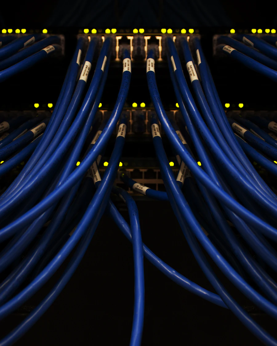 Network cables connected across a server rack